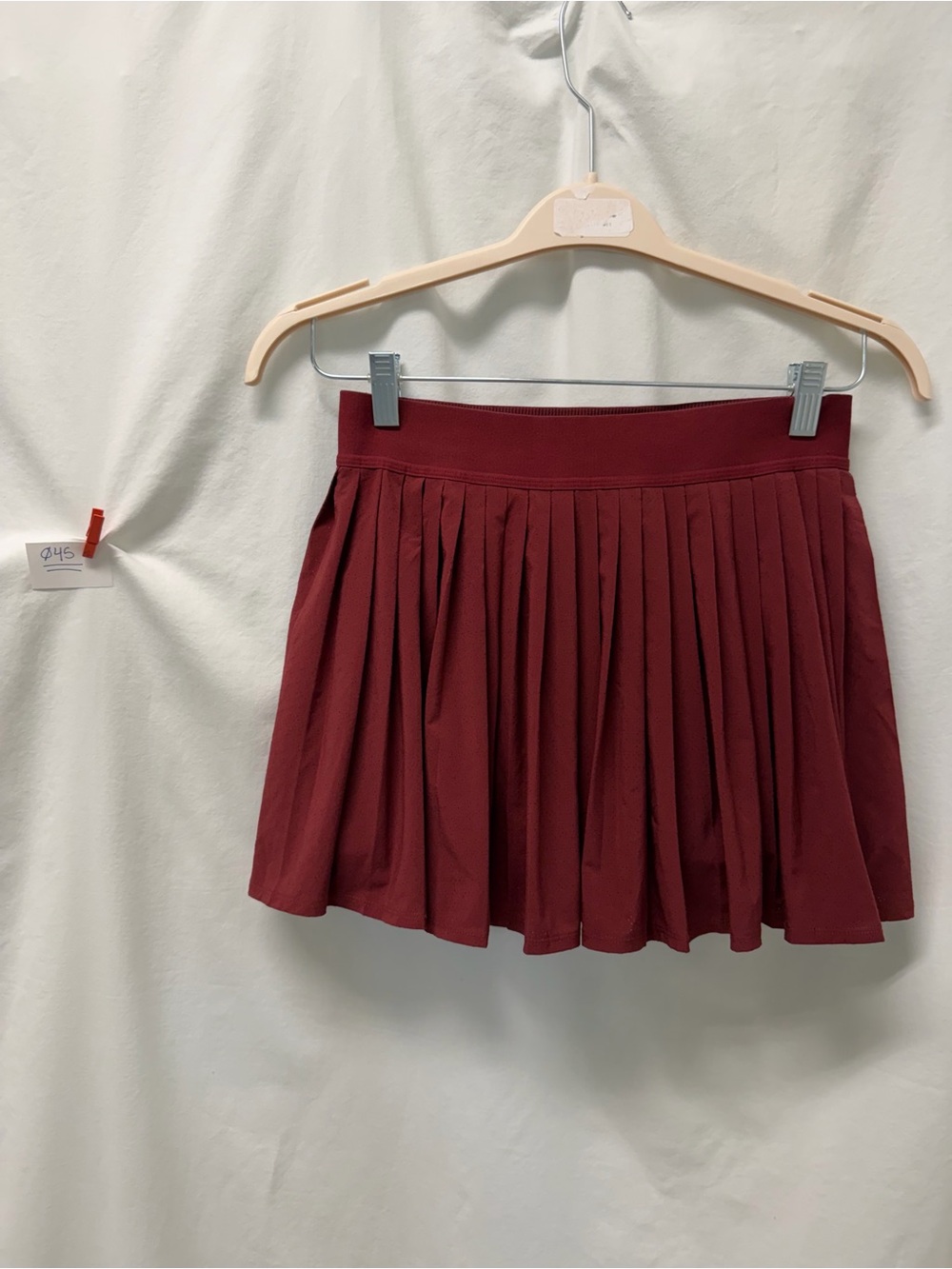 Athleta Burgundy Match Point pleated laser cut skort